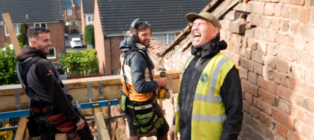 A professional trainer speaking to a group of construction learners