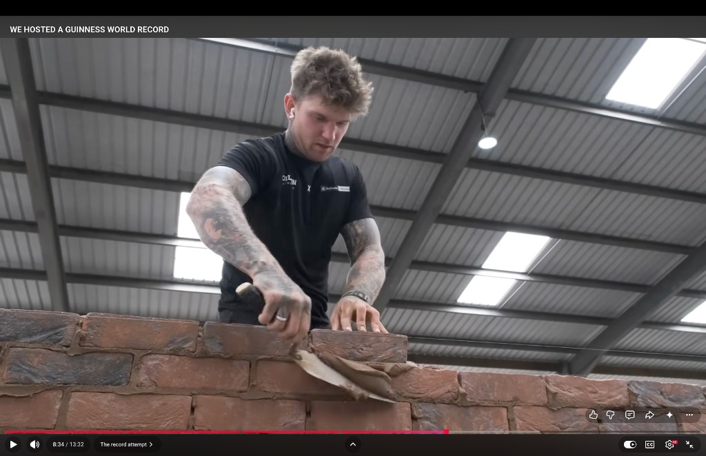 Charlie Collison laying bricks during the Guinness World Record attempt
