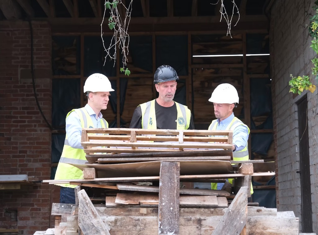 The team reviewing drawings on site at Sharmer Farm